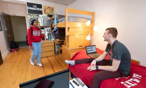 Photo of two  students in an on-campus residence hall