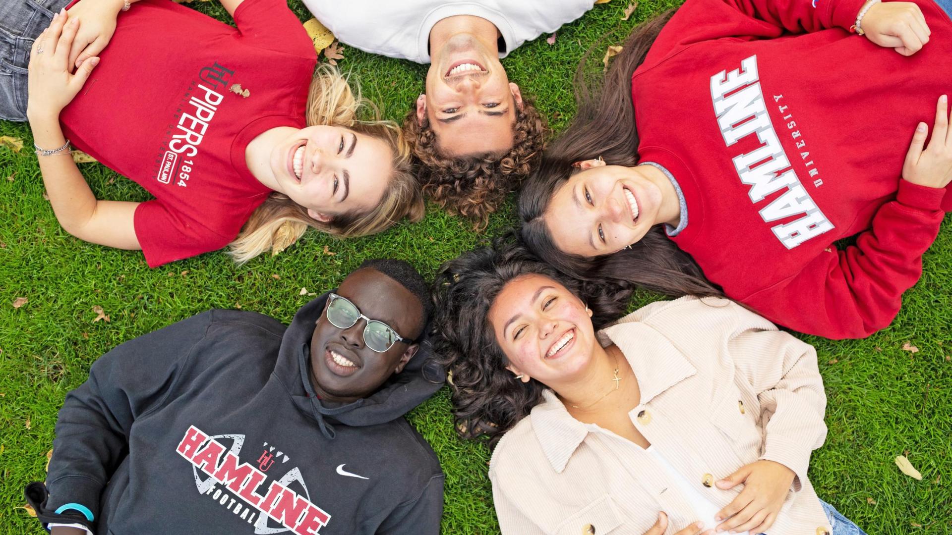 Students with  sweatshirts relaxing